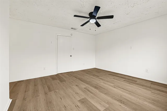a white toilet sitting next to a shower