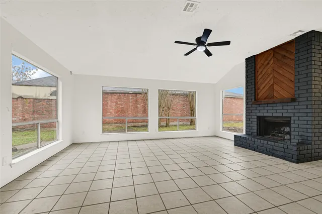 a view of an empty room with a fireplace