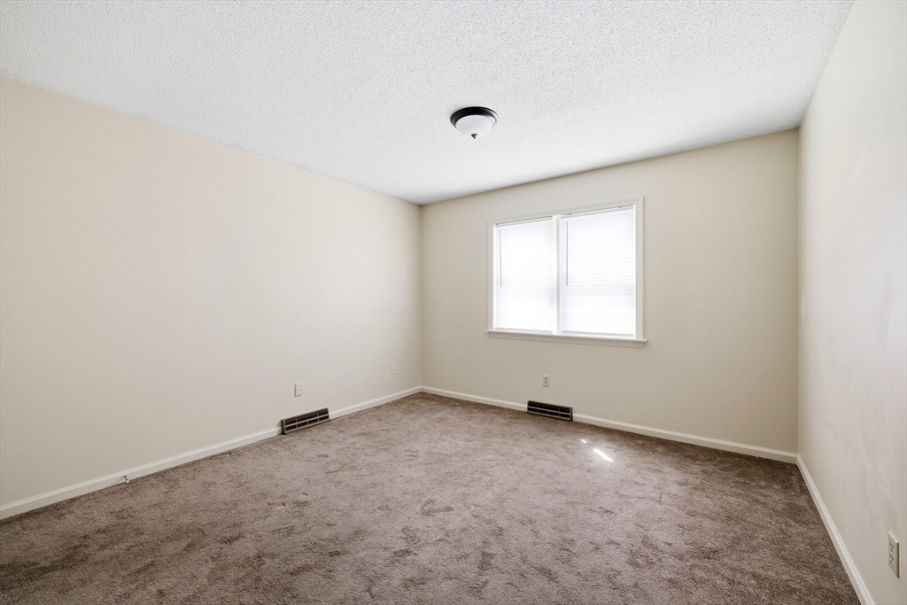 19-21 Wedgewood Circle Springfield, MA 01129 - Photo 26 of 32 an empty room with a window