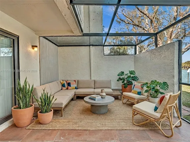 a white toilet sitting next to a shower curtain