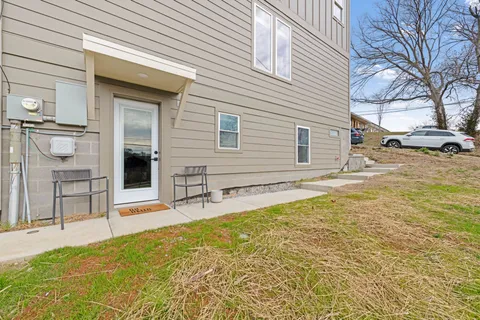 a view of a house with a backyard
