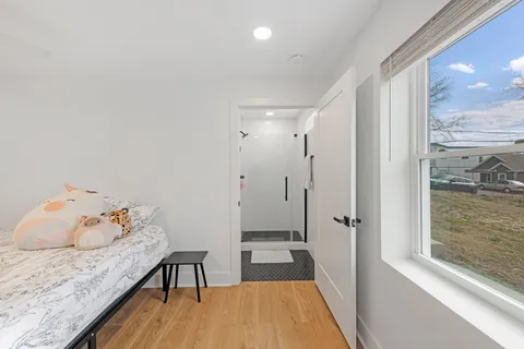 a bathroom with a tub and shower
