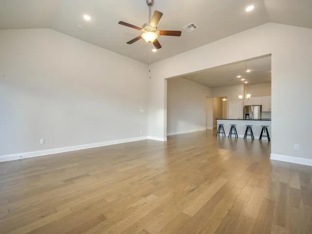 a view of kitchen and dining room with wooden floor