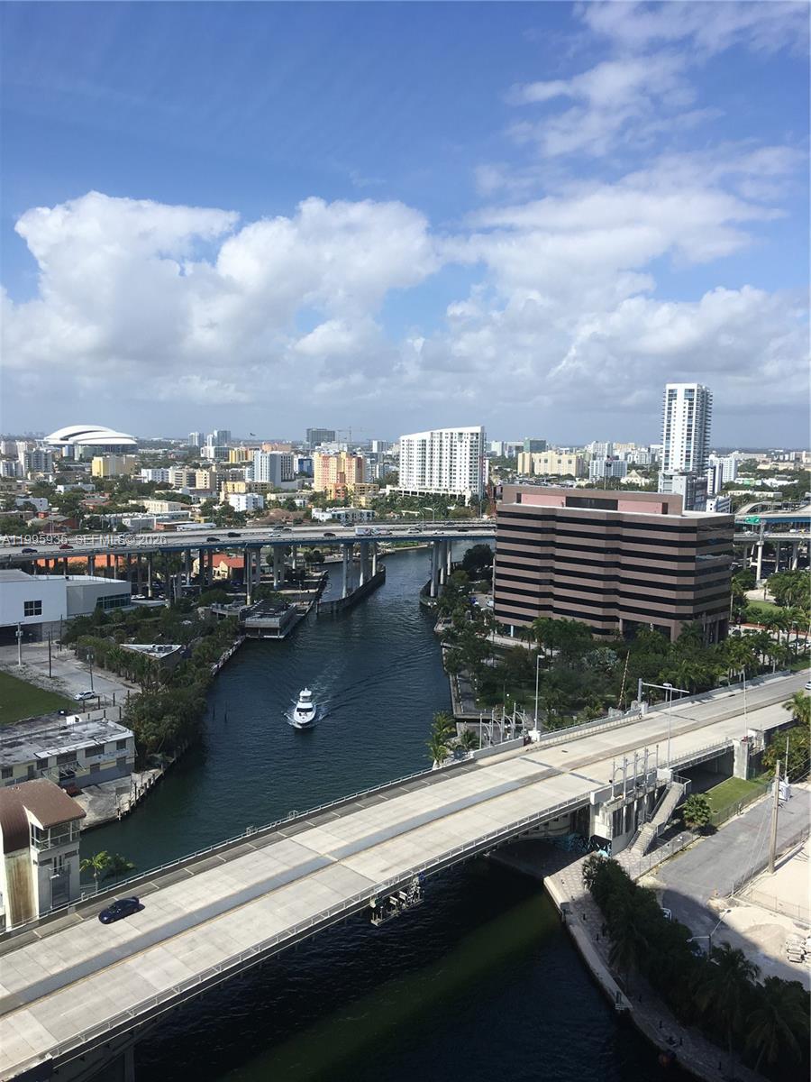 185 Southwest 7th Street, Unit 3211 Miami, FL 33130 - Photo 3 of 15 a view of a lake from a balcony