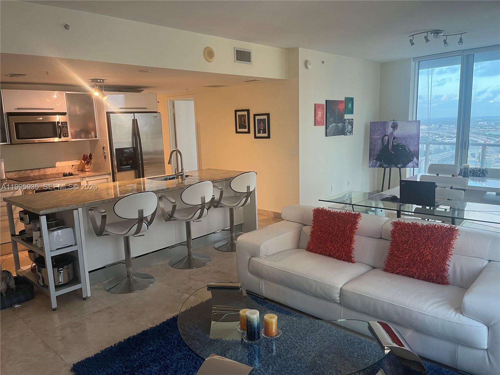 185 Southwest 7th Street, Unit 3211 Miami, FL 33130 - Photo 5 of 15 a living room with furniture