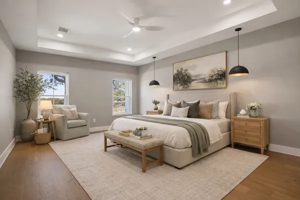 a spacious bedroom with a bed and glass window
