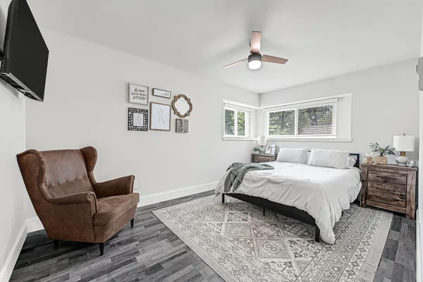 a bedroom with a bed and a couch