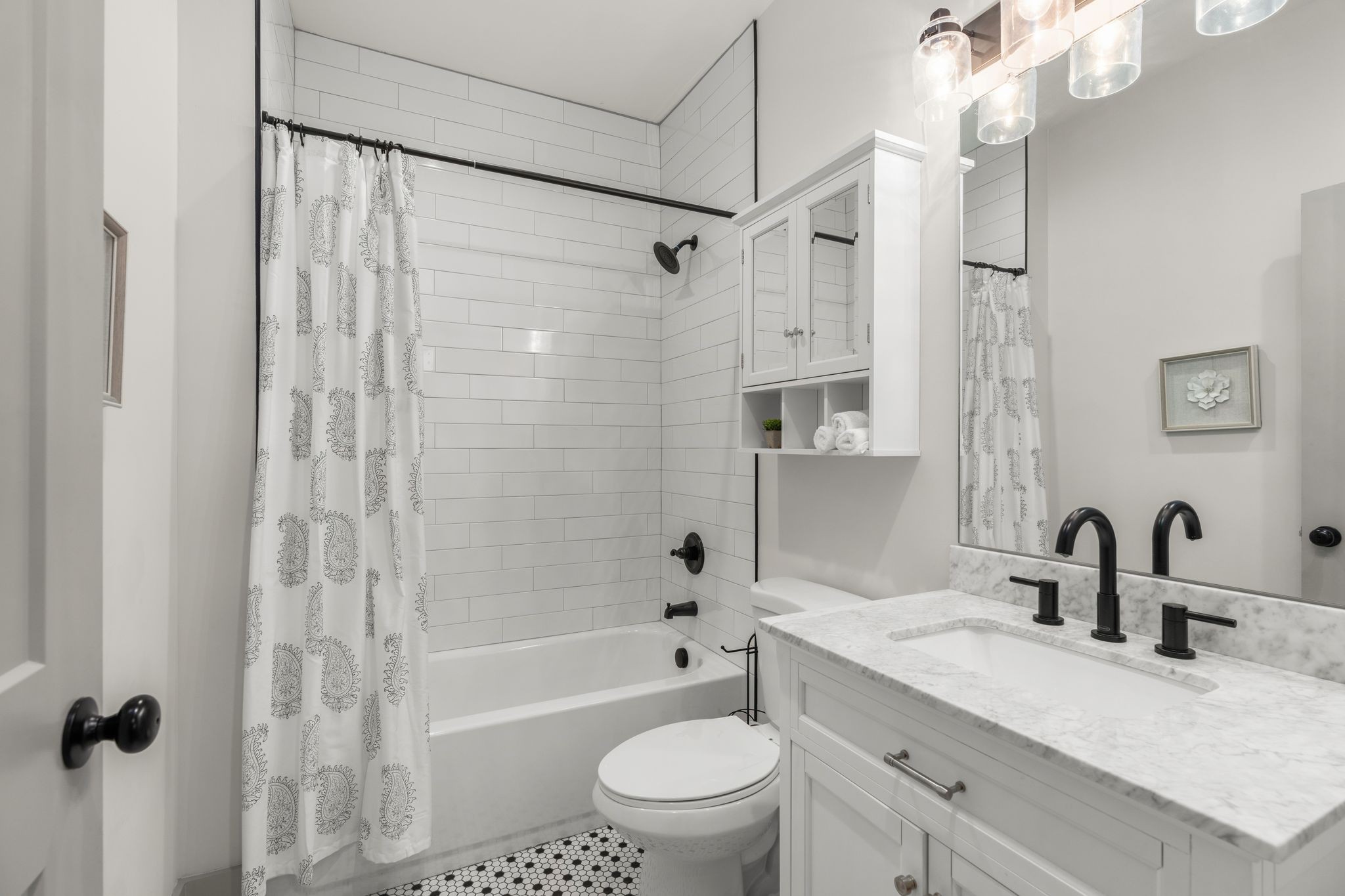 2660 Barclay Drive, Unit B Nashville, TN 37206 - Photo 15 of 29 a bathroom with a sink a toilet and shower