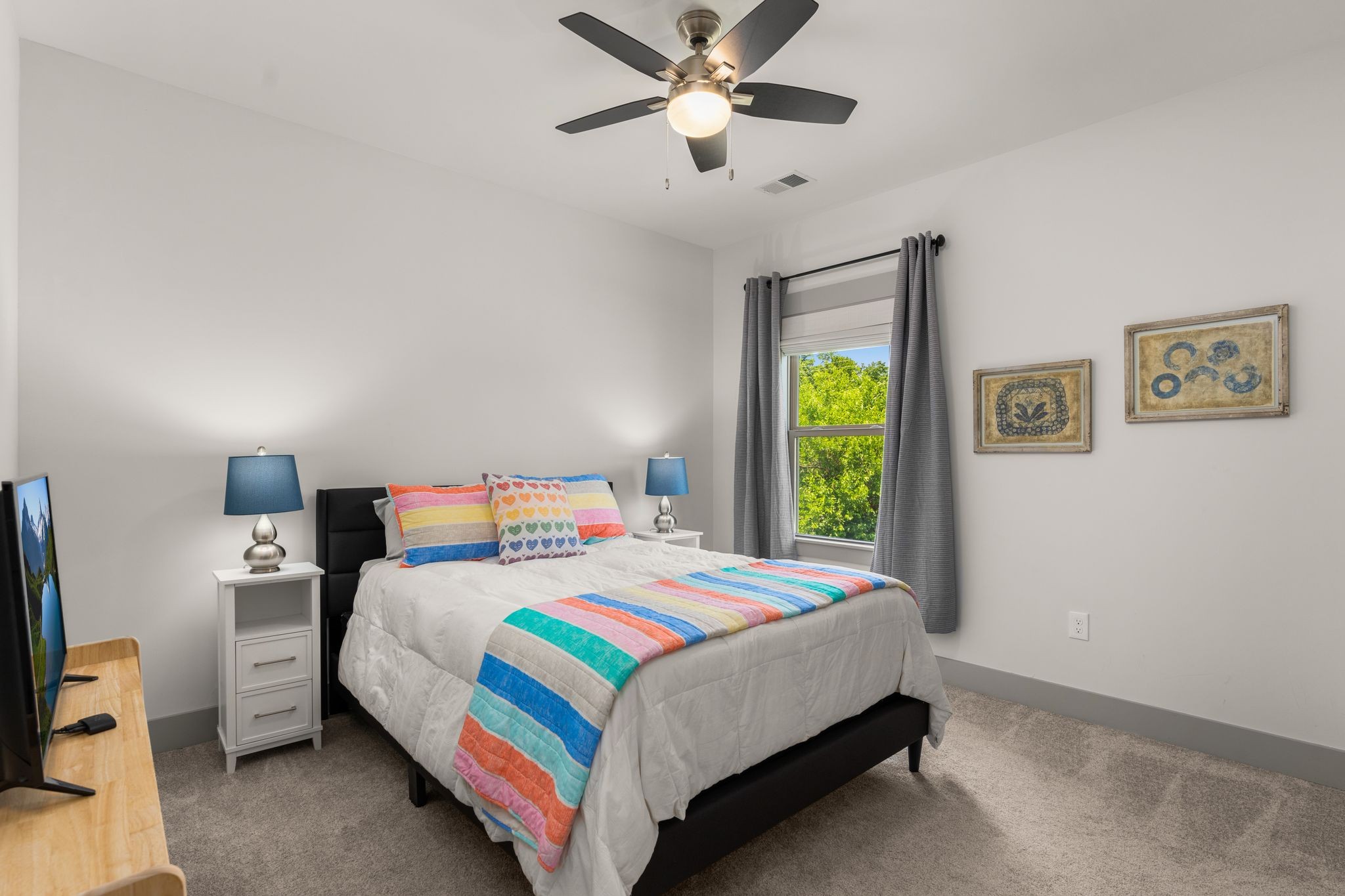 2660 Barclay Drive, Unit B Nashville, TN 37206 - Photo 26 of 29 a bedroom with a bed and a chandelier