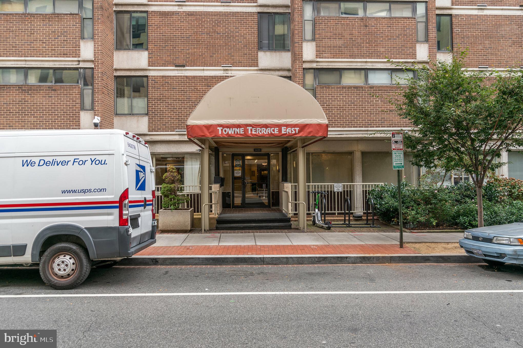 1420 N Street Northwest, Unit 605 Washington, DC 20005 - Photo 12 of 14 a car parked in front of a building