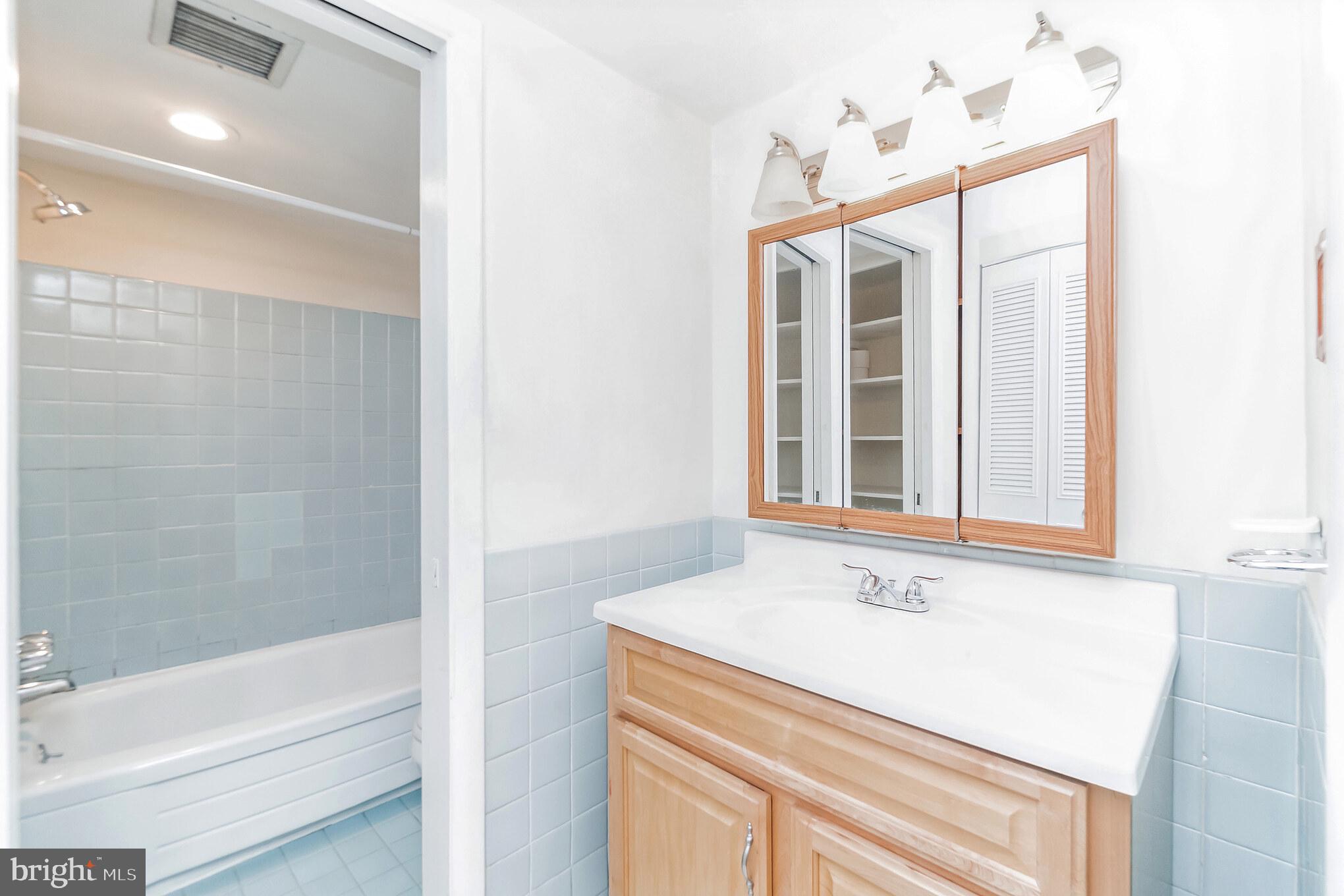 1420 N Street Northwest, Unit 605 Washington, DC 20005 - Photo 10 of 14 a bathroom with a sink and a bathtub