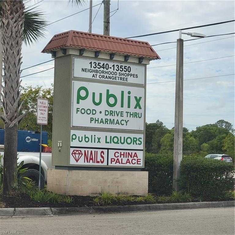 2nd Street Northeast Naples, FL 34120 - Photo 17 of 17 a sign on the side of a building