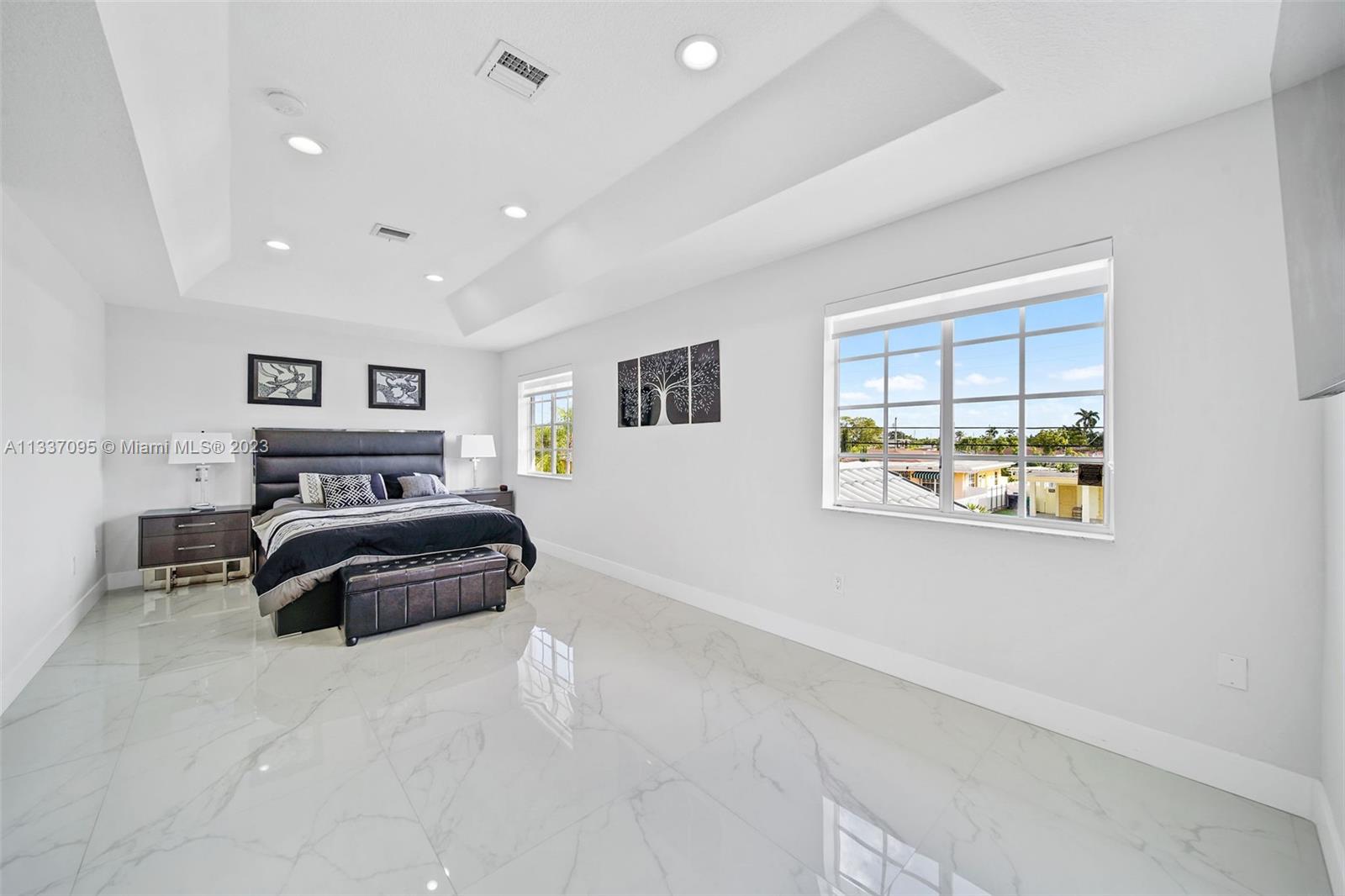 3436 Southwest 88th Place Miami, FL 33165 - Photo 29 of 43 a bedroom with a bed and a painting on the wall