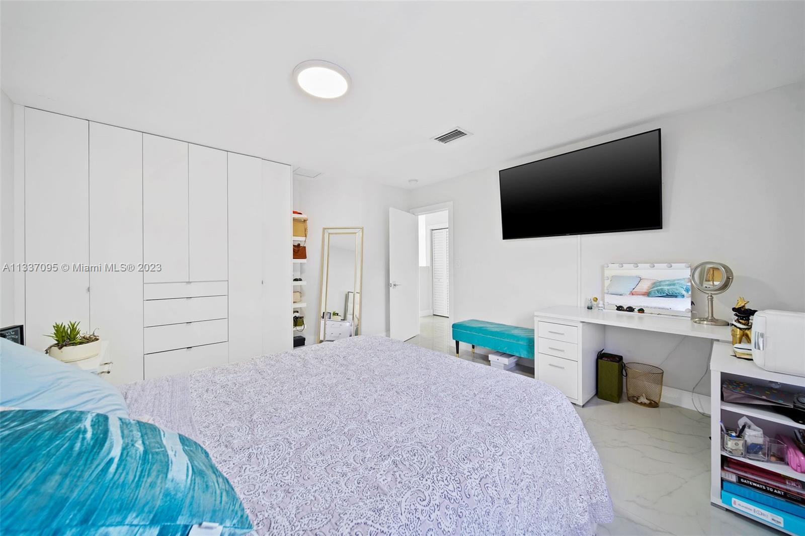 3436 Southwest 88th Place Miami, FL 33165 - Photo 36 of 43 a bedroom with furniture and a flat screen tv