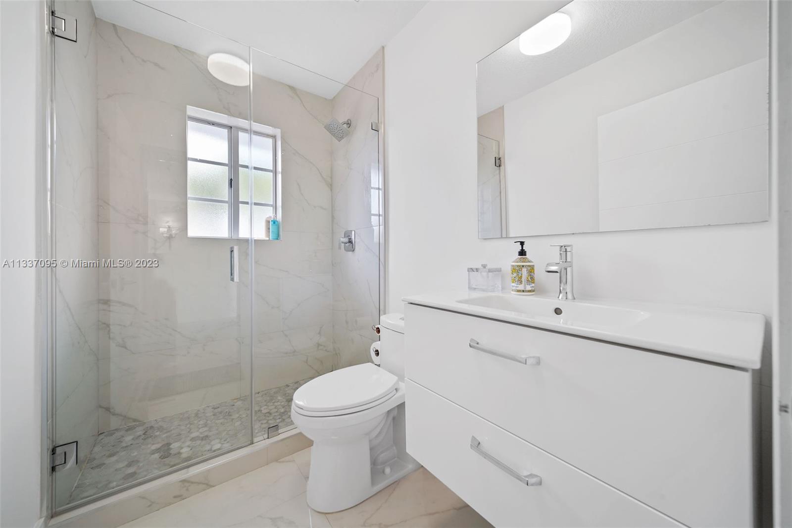 3436 Southwest 88th Place Miami, FL 33165 - Photo 39 of 43 a bathroom with a sink toilet and shower