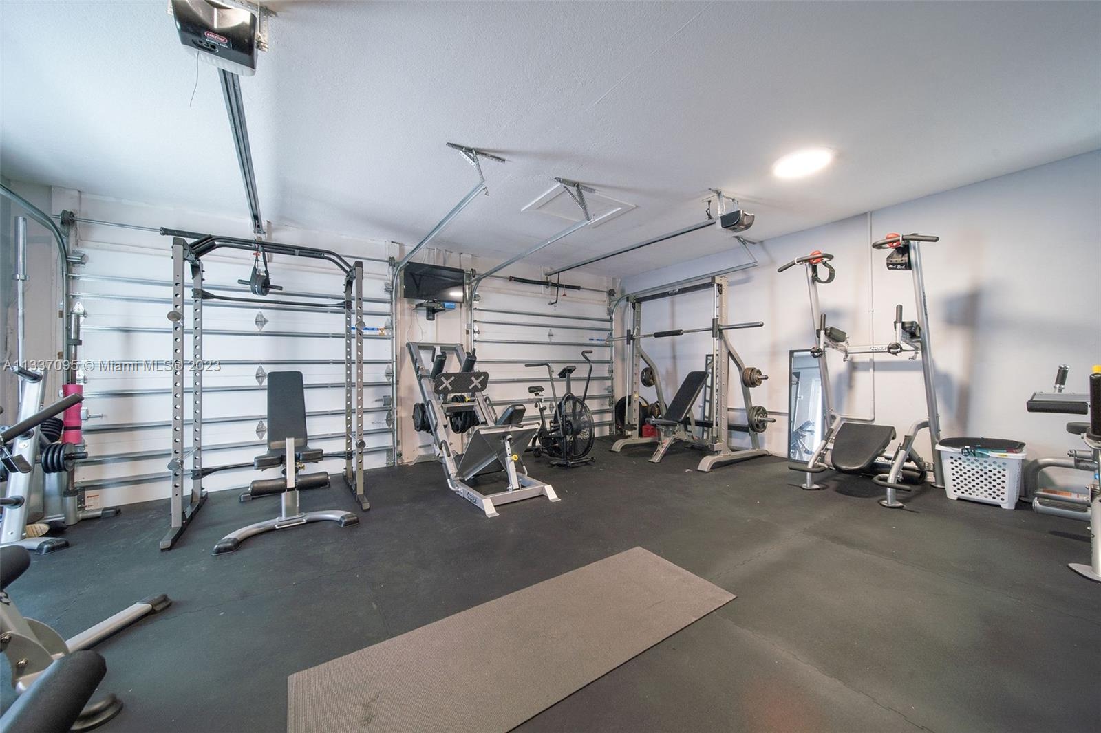 3436 Southwest 88th Place Miami, FL 33165 - Photo 41 of 43 a view of a room with gym equipment