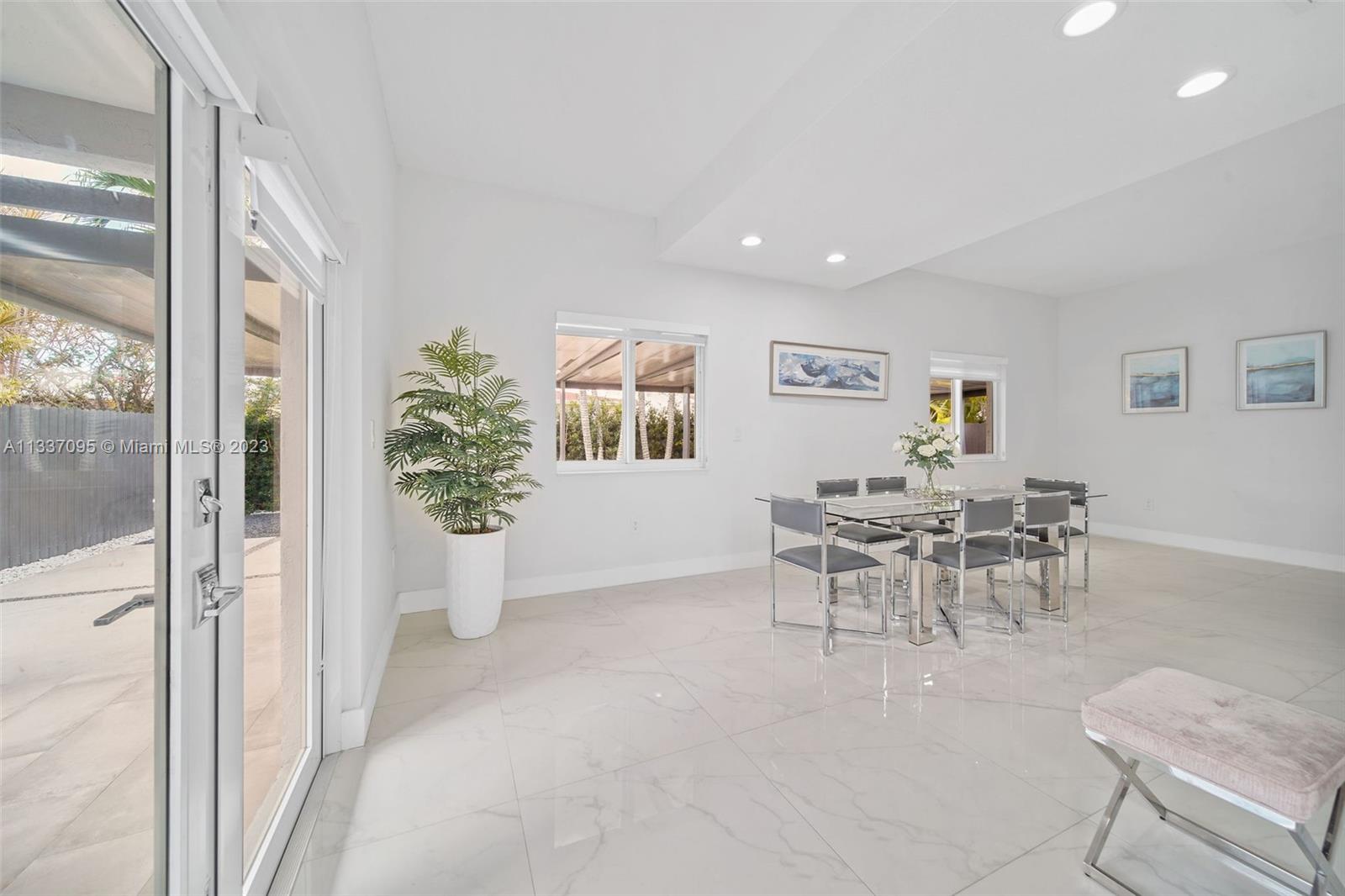 3436 Southwest 88th Place Miami, FL 33165 - Photo 7 of 43 a view of a dining room with furniture and a potted plant