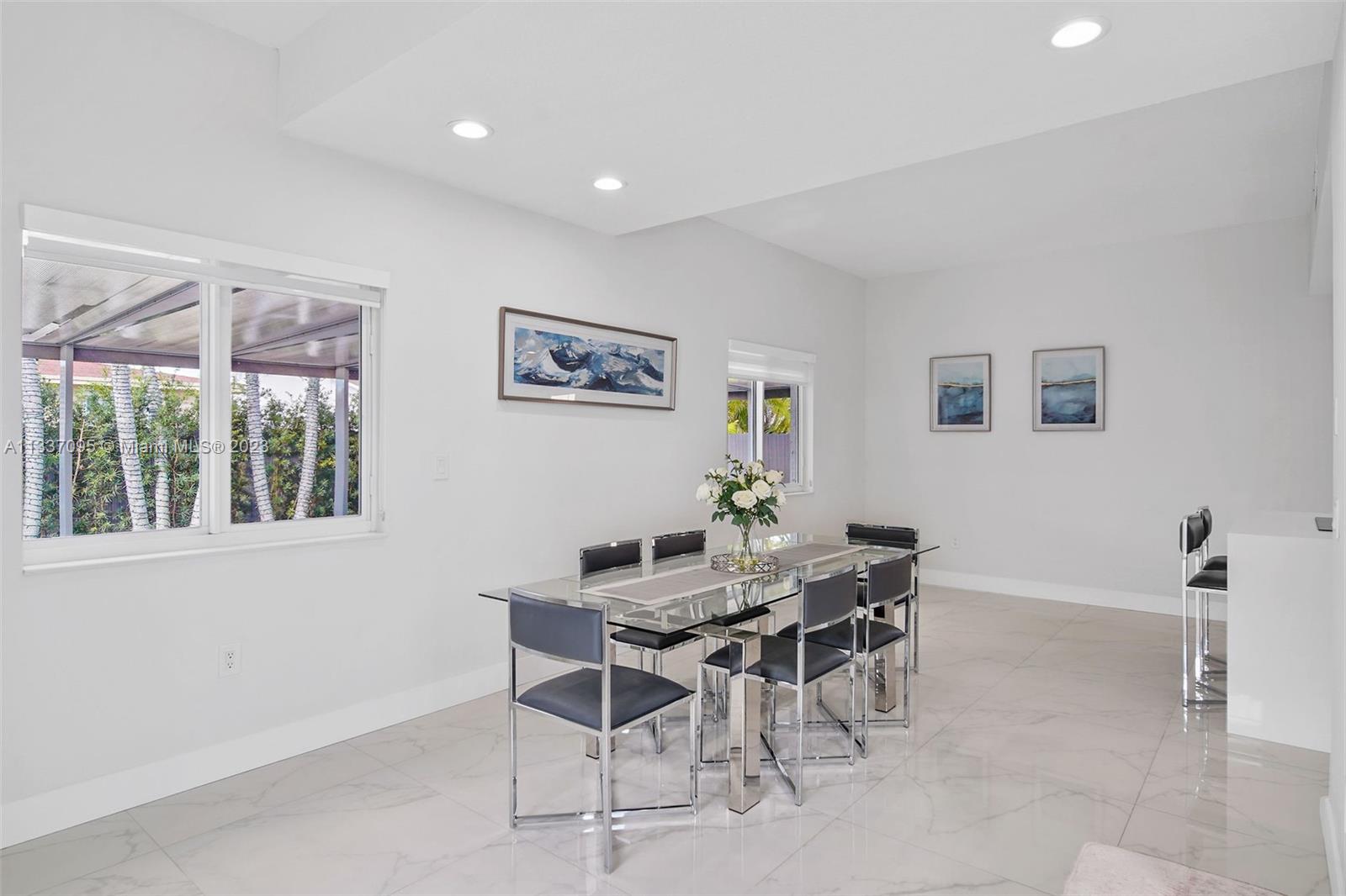 3436 Southwest 88th Place Miami, FL 33165 - Photo 8 of 43 a view of a dining room with furniture