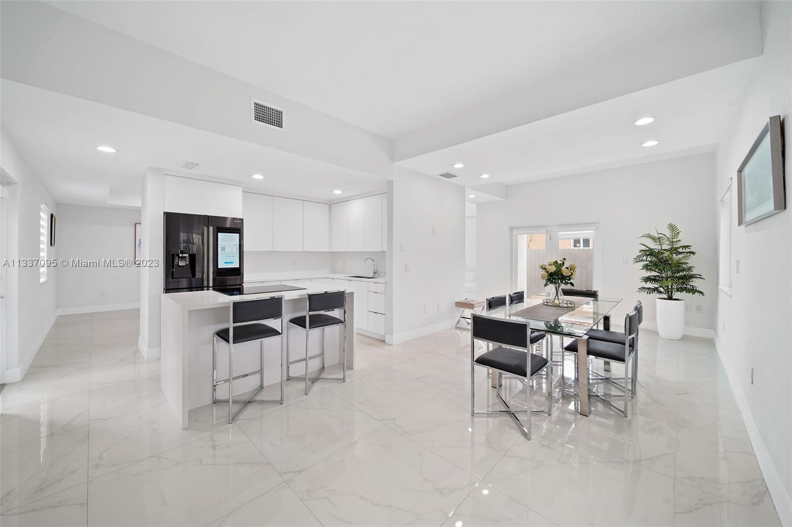 3436 Southwest 88th Place Miami, FL 33165 - Photo 9 of 43 a view of a dining area with furniture