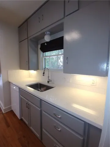 a kitchen with a sink and a window