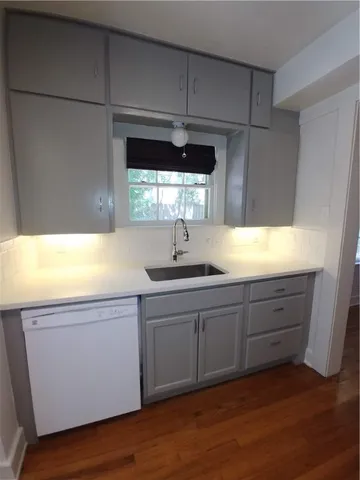 a kitchen with sink and window