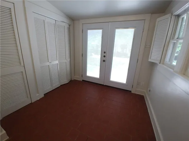 an empty room with windows