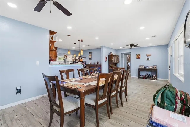 a dining room with furniture and window