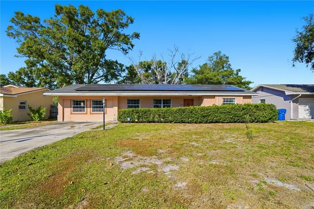 front view of a house with a big yard