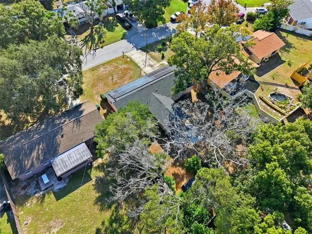an aerial view of residential house with outdoor space and swimming pool