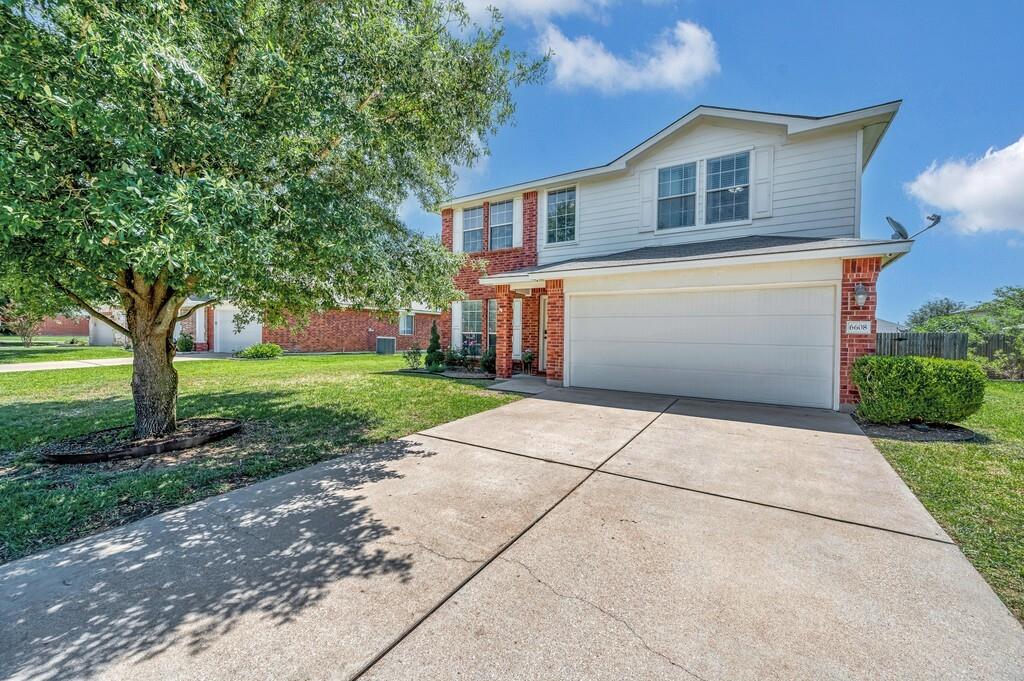 a front view of a house with yard