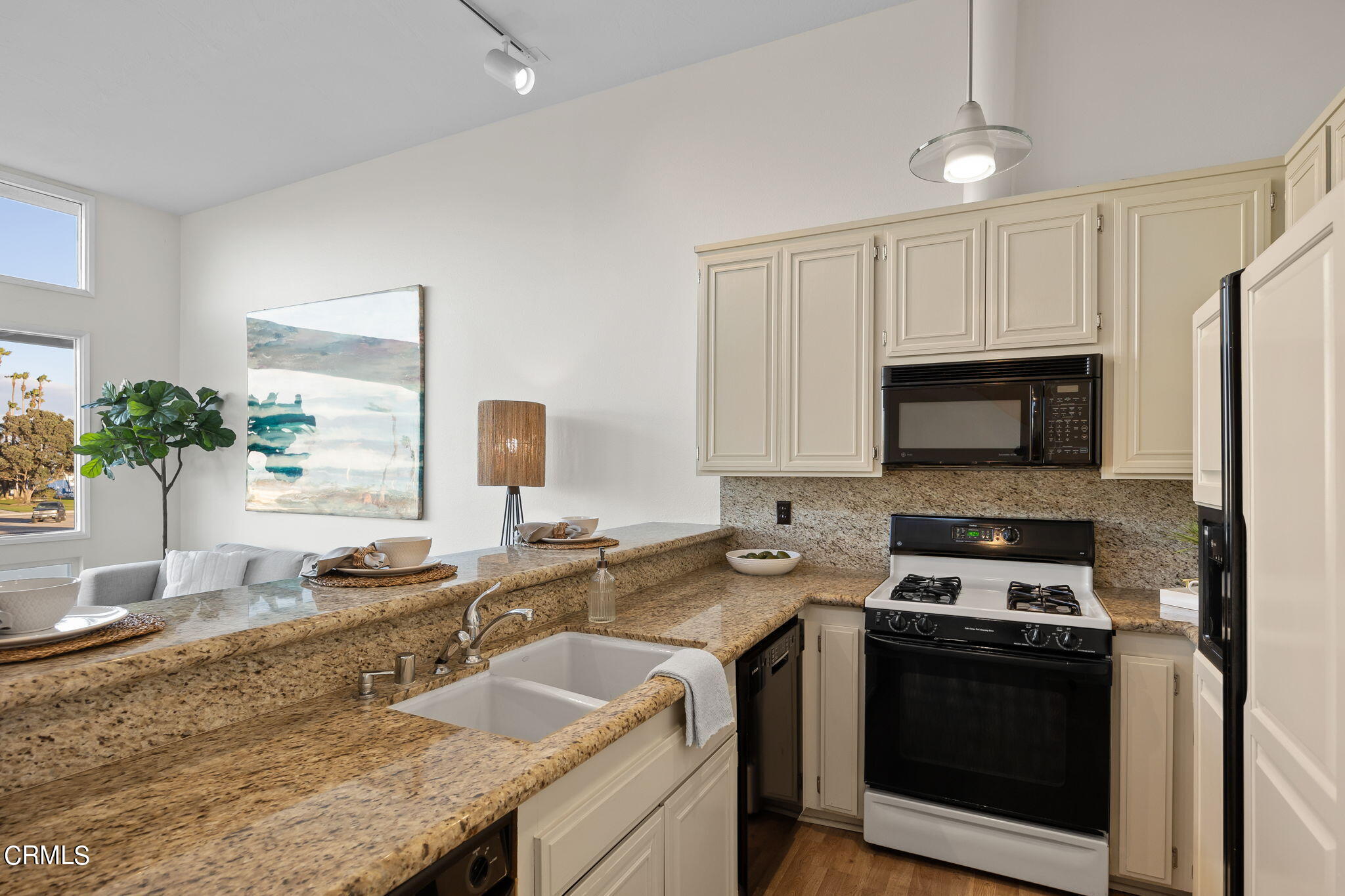3547 Sunset Lane Oxnard, CA 93035 - Photo 12 of 24 a kitchen with granite countertop a sink stainless steel appliances and cabinets