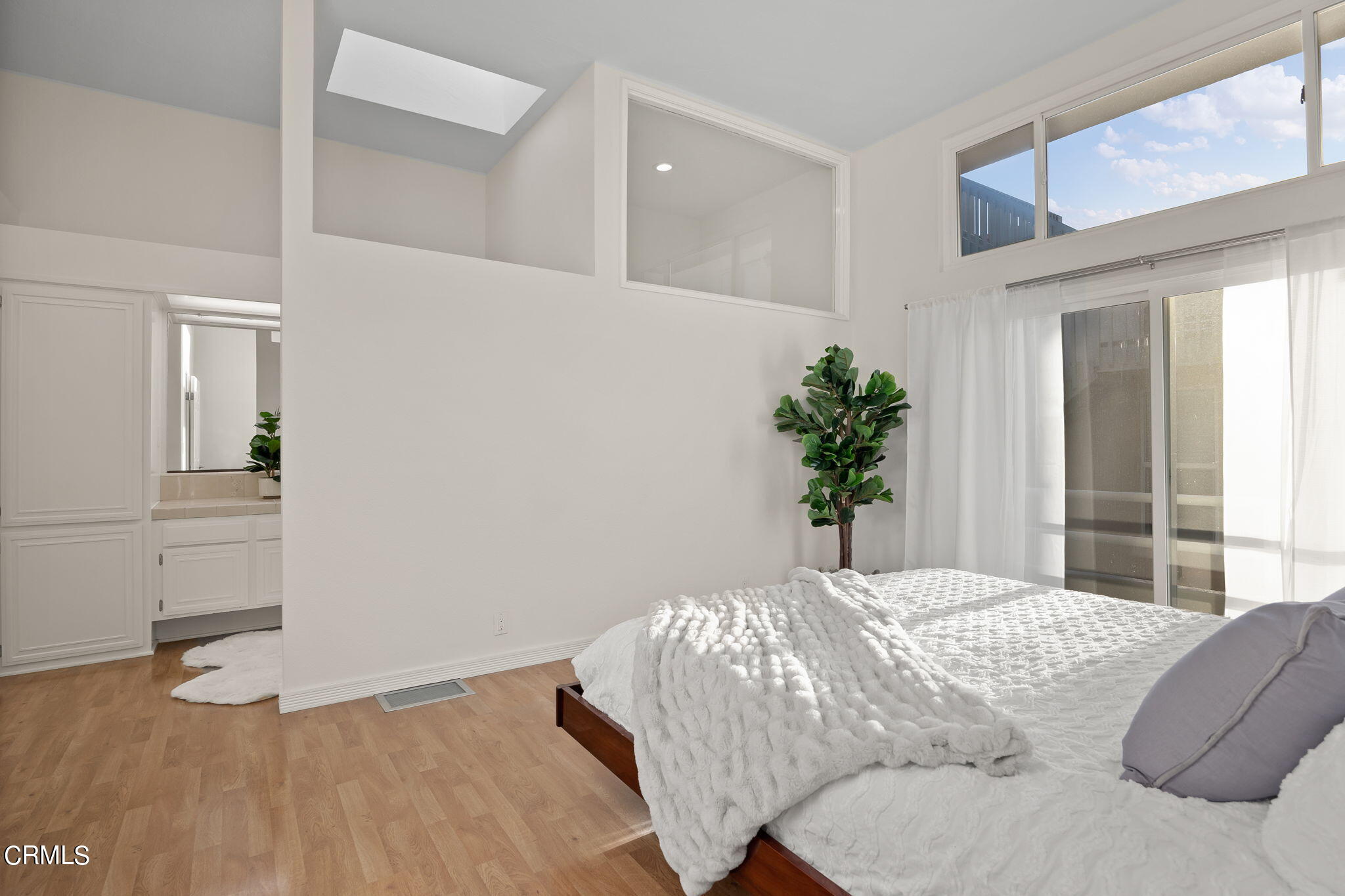 3547 Sunset Lane Oxnard, CA 93035 - Photo 14 of 24 a bedroom with a bed and a potted plant