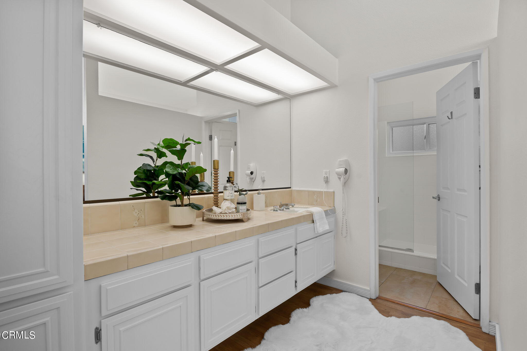 3547 Sunset Lane Oxnard, CA 93035 - Photo 15 of 24 a bathroom with a sink and mirror