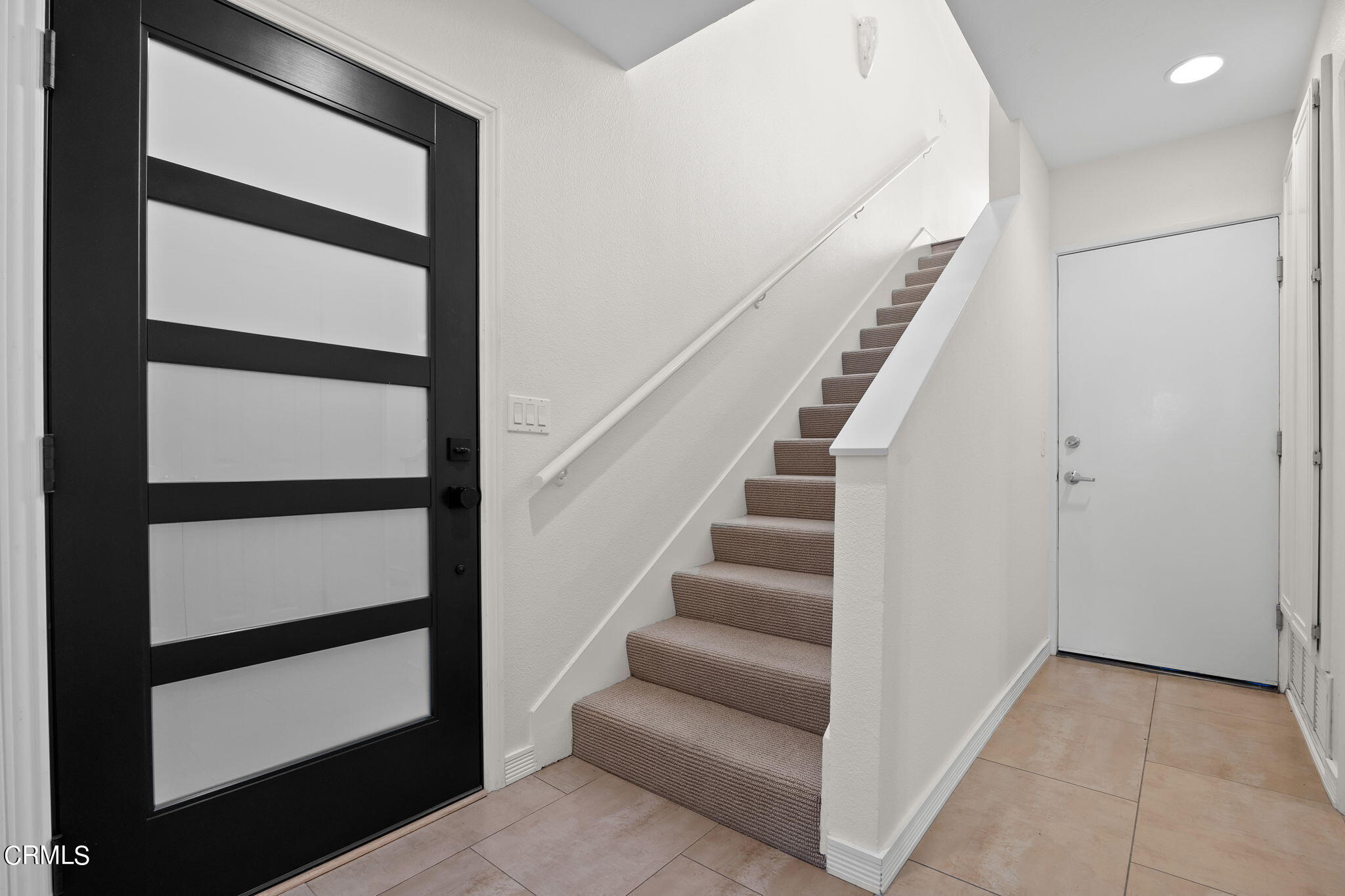 3547 Sunset Lane Oxnard, CA 93035 - Photo 19 of 24 a view of staircase with white walls and a window