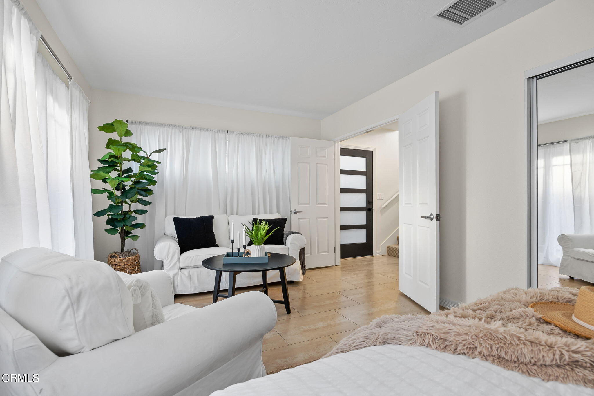 3547 Sunset Lane Oxnard, CA 93035 - Photo 8 of 24 a living room with furniture and potted plants