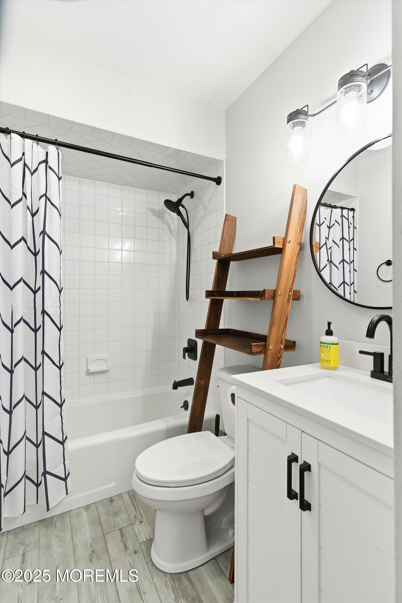132 Sampson Avenue, Unit 2 Seaside Heights, NJ 08751 - Photo 16 of 41 a bathroom with a sink a toilet and shower