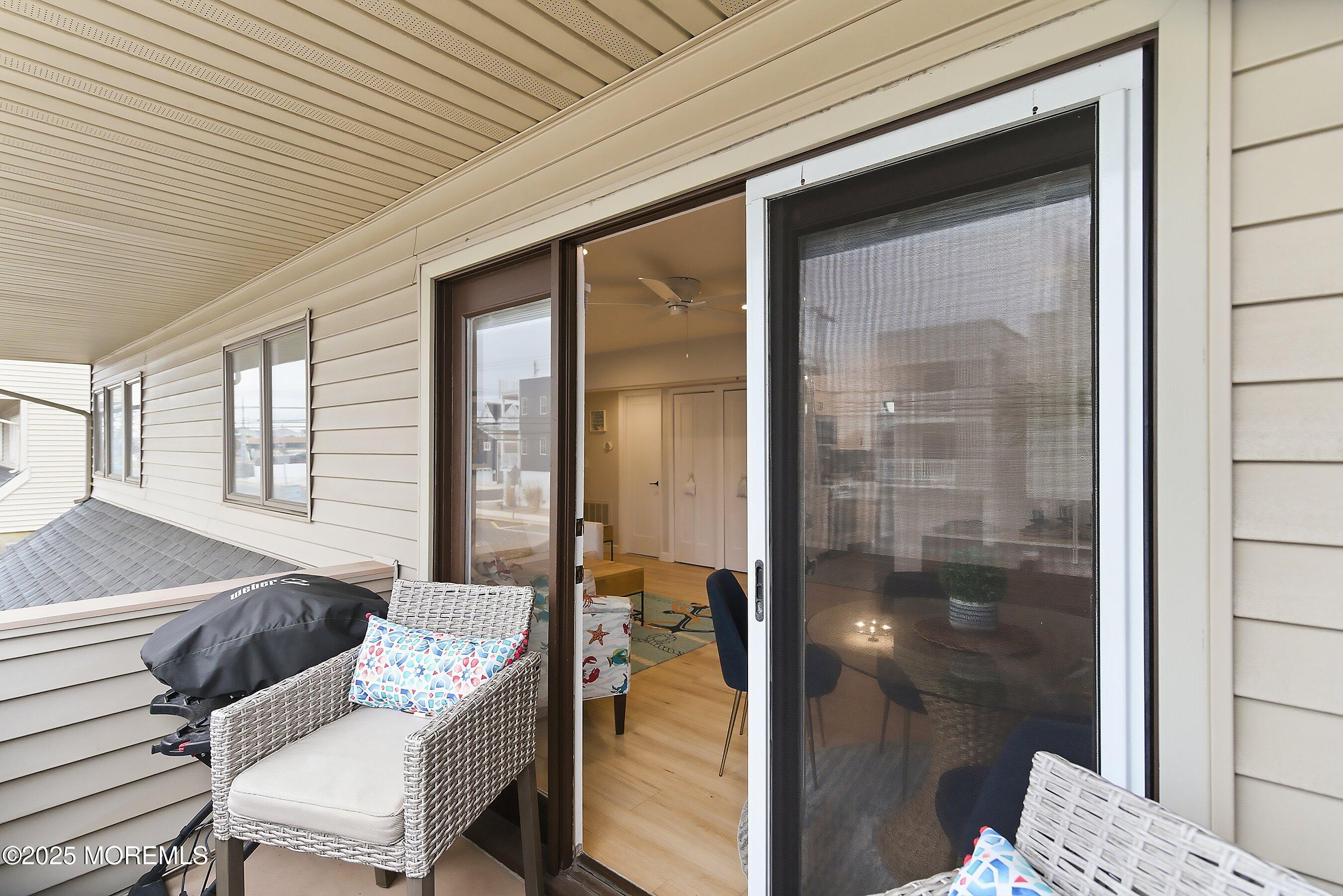 132 Sampson Avenue, Unit 2 Seaside Heights, NJ 08751 - Photo 19 of 41 a room with furniture and a table