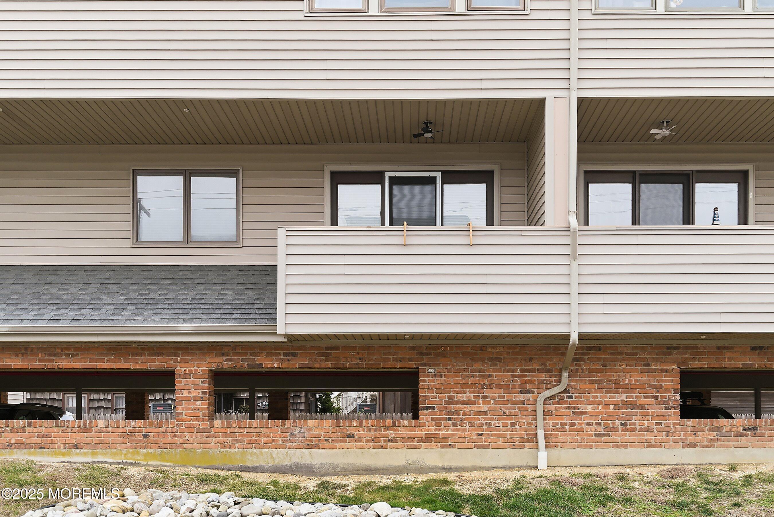 132 Sampson Avenue, Unit 2 Seaside Heights, NJ 08751 - Photo 25 of 41 a view of a house with a yard and sitting area