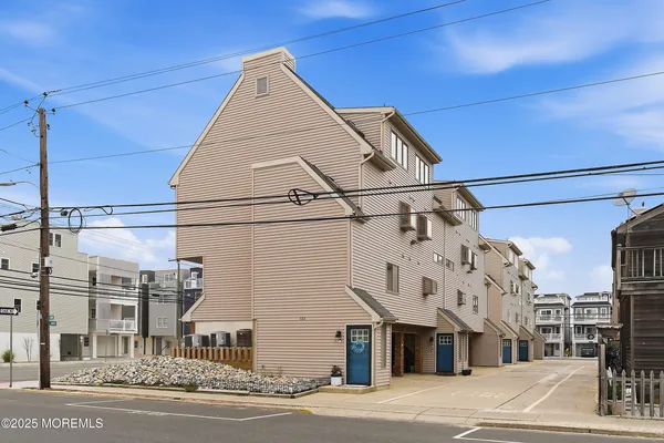 a view of a street with a building in the background