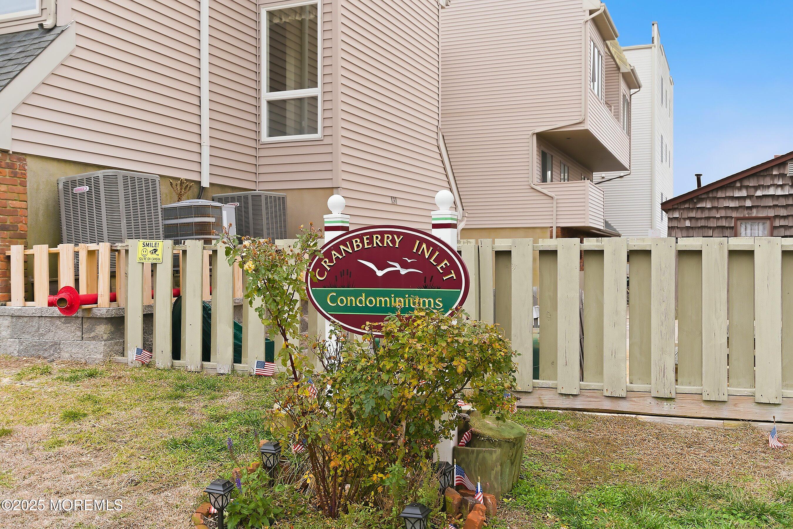 132 Sampson Avenue, Unit 2 Seaside Heights, NJ 08751 - Photo 28 of 41 a view of a brick house with a yard and plants