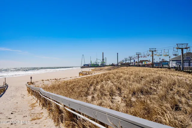 a view of swimming pool with outdoor seating and yard in back