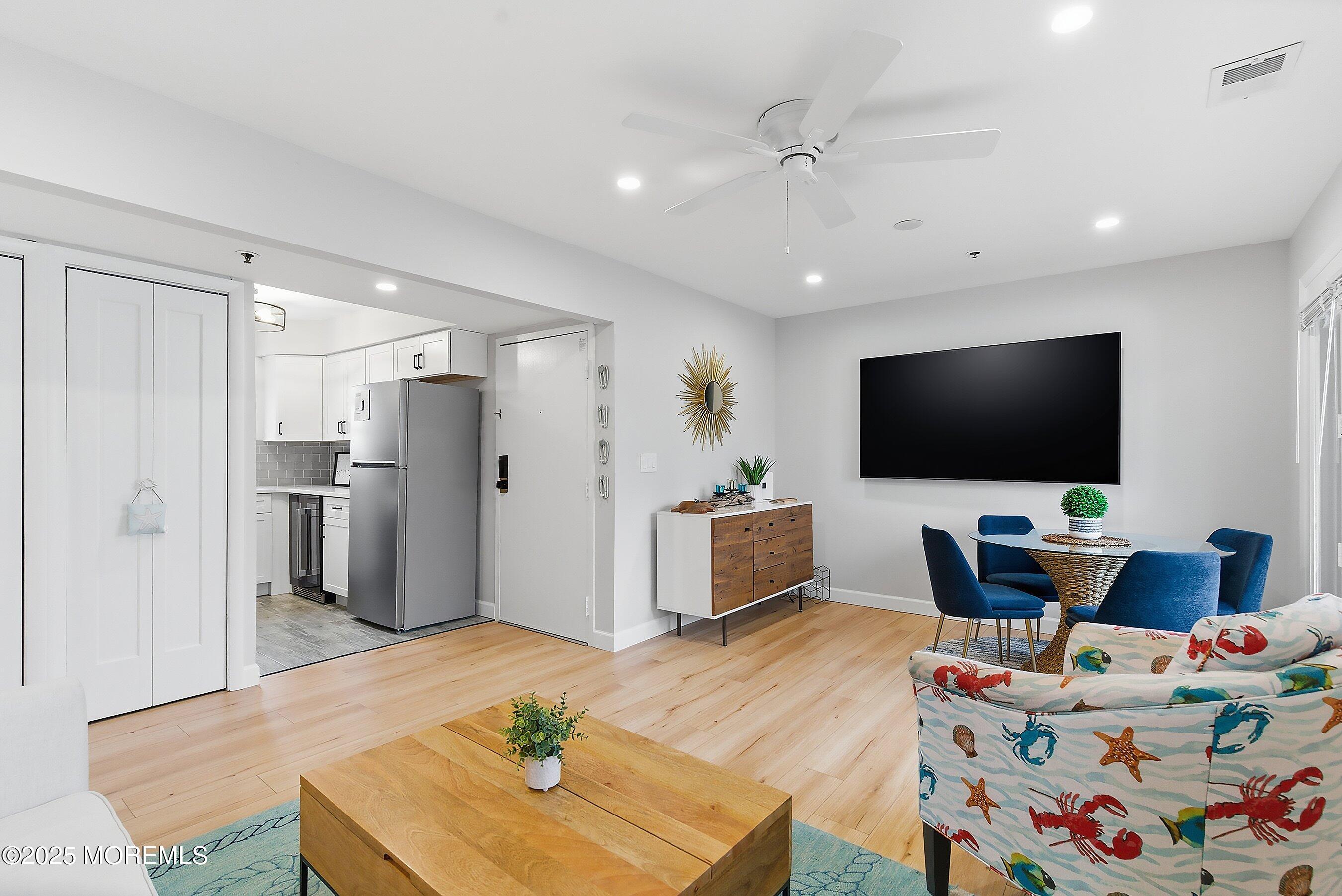 132 Sampson Avenue, Unit 2 Seaside Heights, NJ 08751 - Photo 4 of 41 a living room with furniture and a flat screen tv
