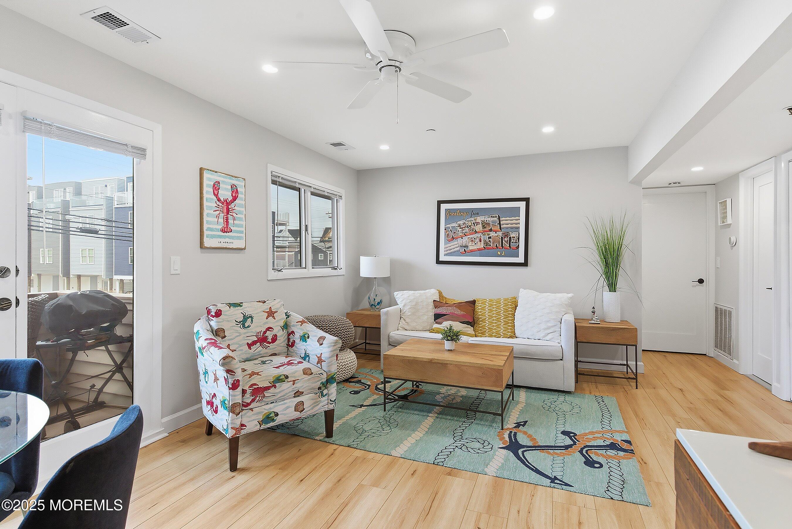 132 Sampson Avenue, Unit 2 Seaside Heights, NJ 08751 - Photo 5 of 41 a living room with furniture and wooden floor