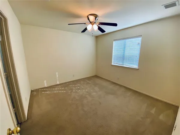 a view of empty room with windows
