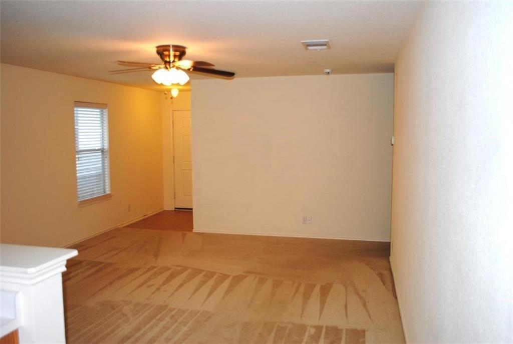 512 Celery Loop Austin, TX 78748 - Photo 17 of 26 a view of a livingroom with a chandelier fan and a bathroom