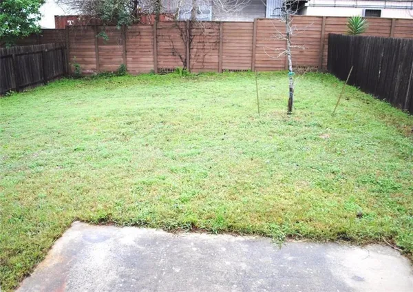 a view of a backyard of the house