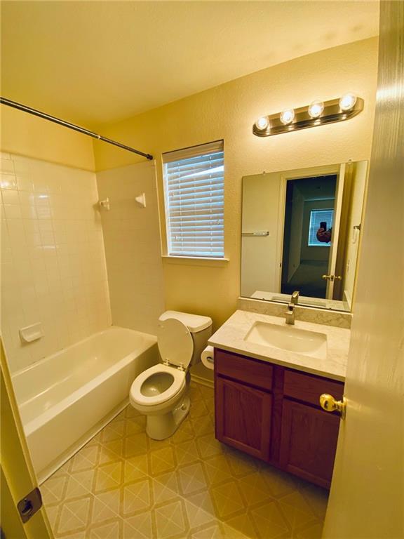 512 Celery Loop Austin, TX 78748 - Photo 8 of 26 a bathroom with a sink a toilet and shower