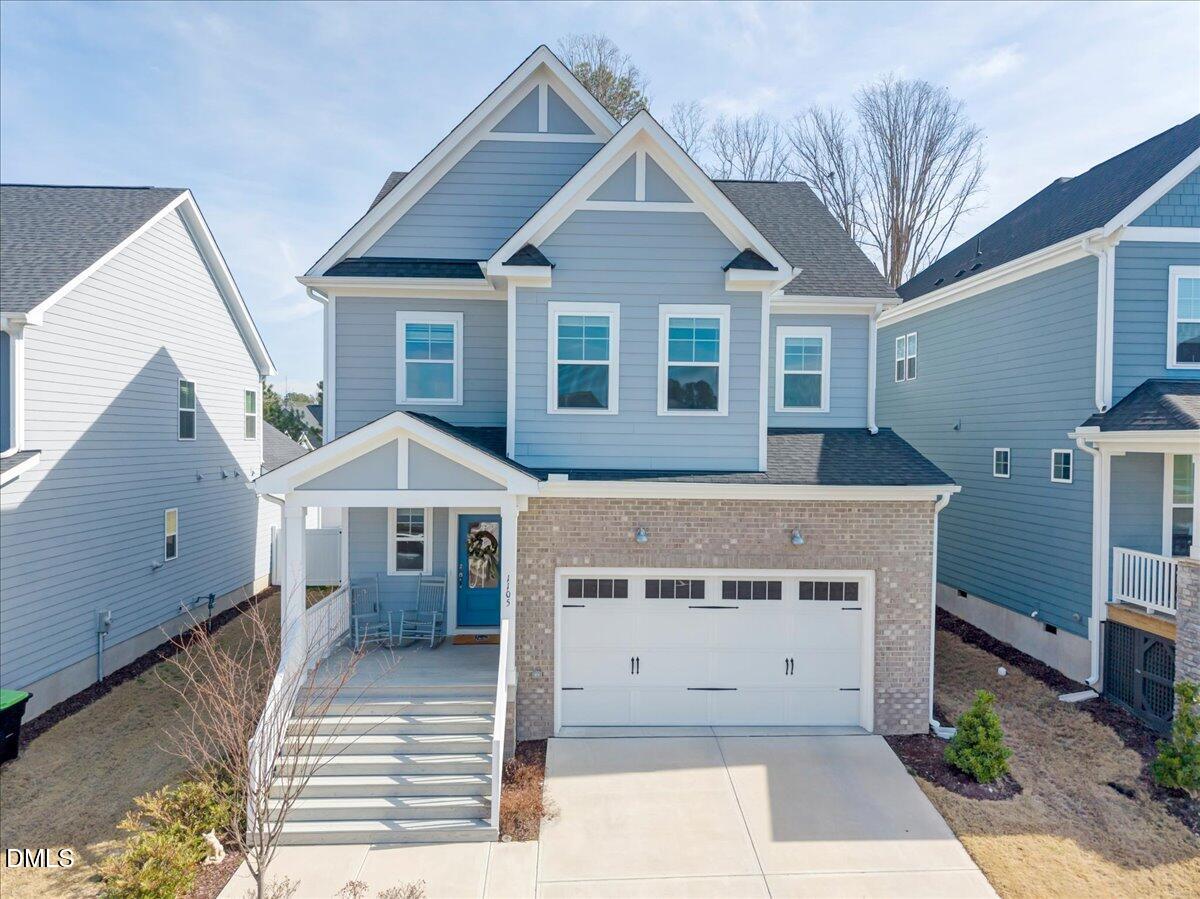 1105 Logperch Way Wendell, NC 27591 - Photo 26 of 29 a front view of a house with a garden