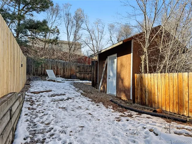 a view of a backyard of the house