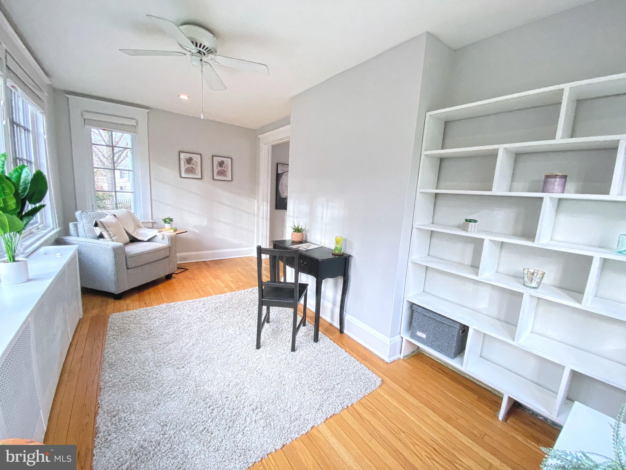 306 St Dunstans Road Baltimore, MD 21212 - Photo 13 of 56 a living room with furniture and a book shelf